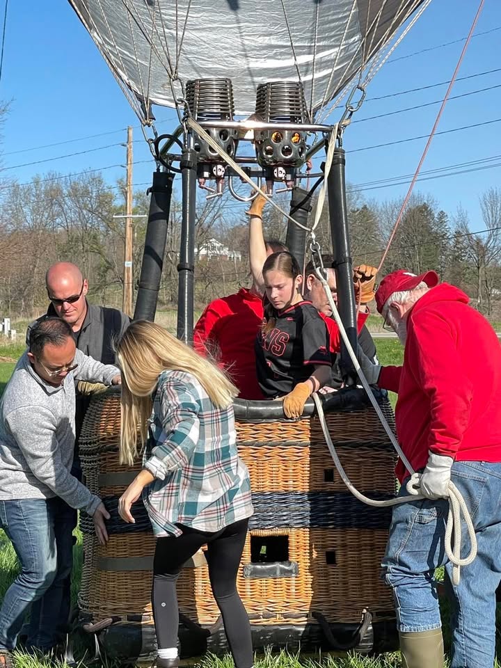 Meg and her softball team showed up this morning to help with the balloon.
