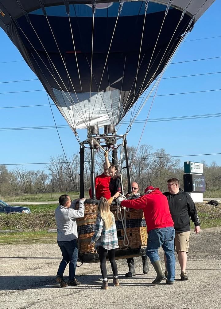 Meg and her softball team showed up this morning to help with the balloon.