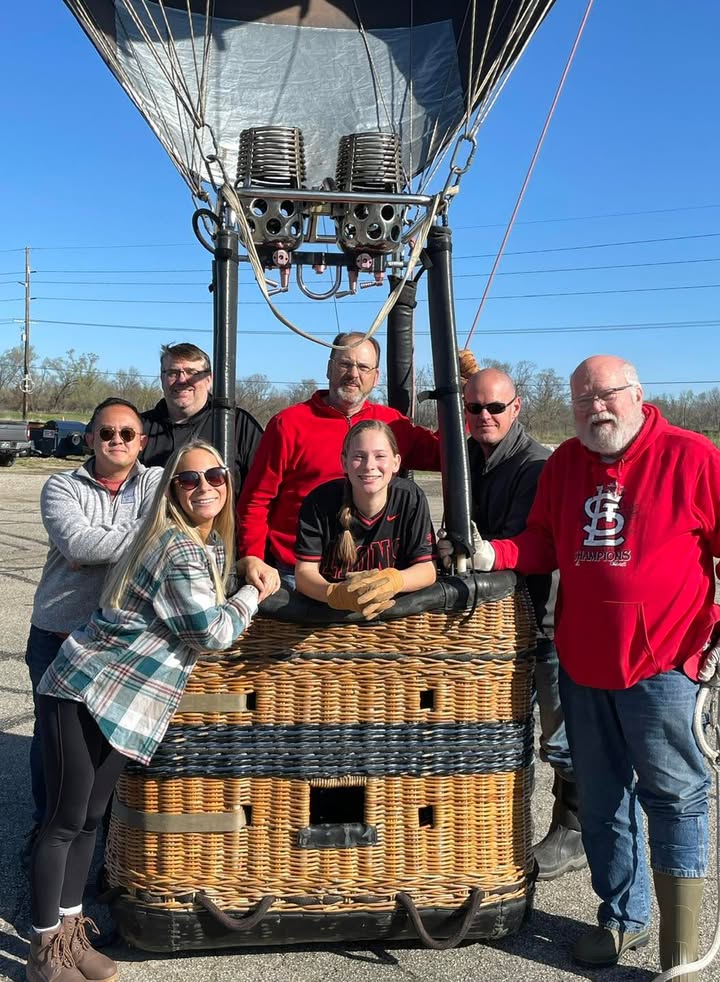 Meg and her softball team showed up this morning to help with the balloon.
