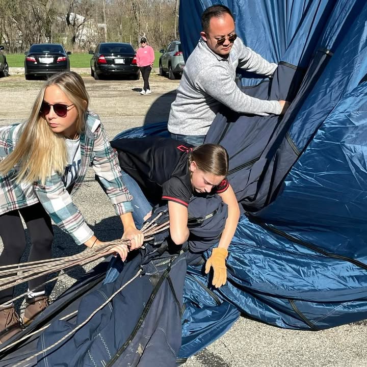 Meg and her softball team showed up this morning to help with the balloon.